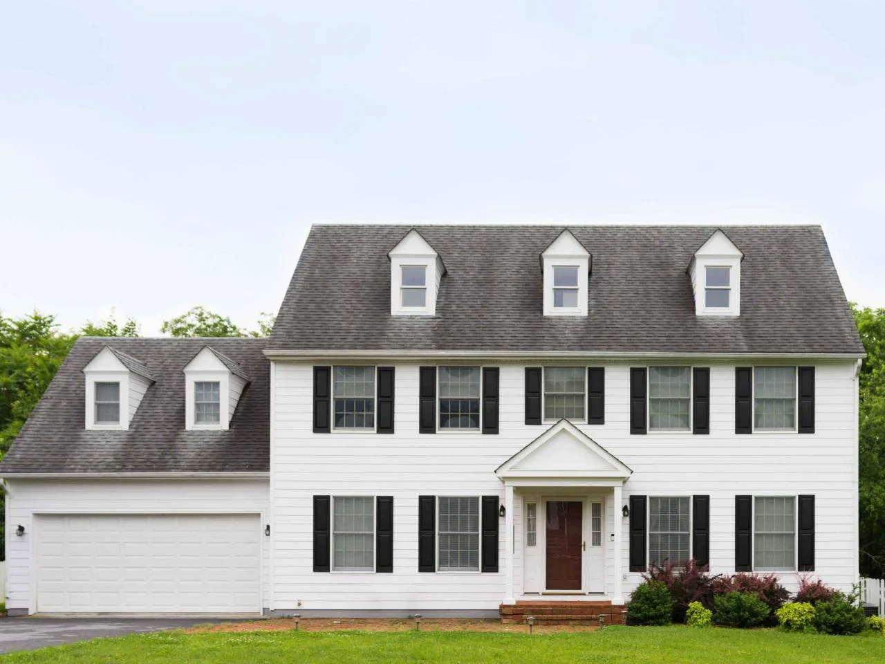 Clean and quaint american colonial house, front street view