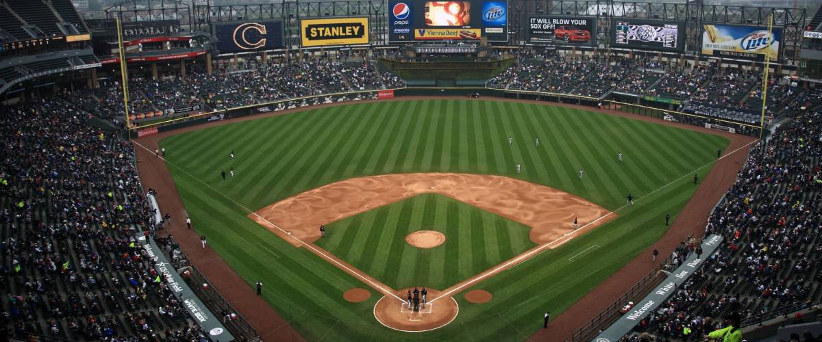 CHICAGO - APRIL 25: White Sox baseball players under the lights and famous upper deck facade